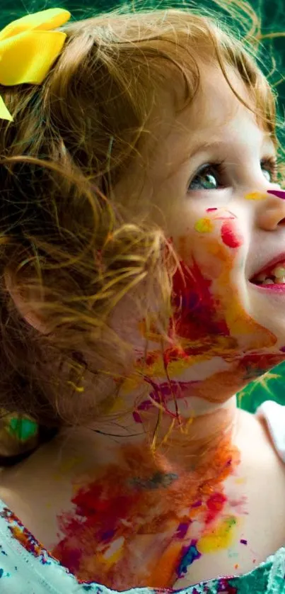 Joyful child with colorful face paint smiling brightly.