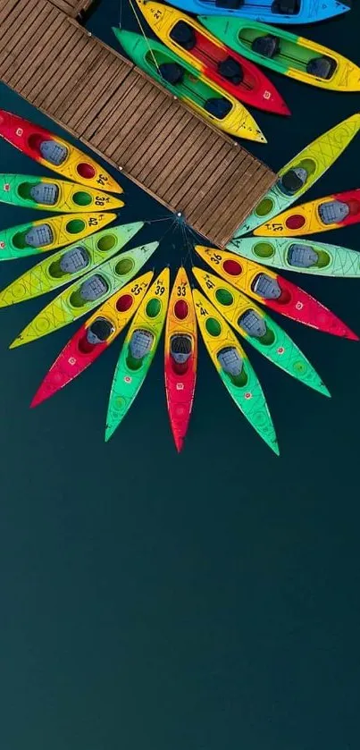 Aerial view of colorful kayaks arranged in a circular pattern on a dark blue lake.