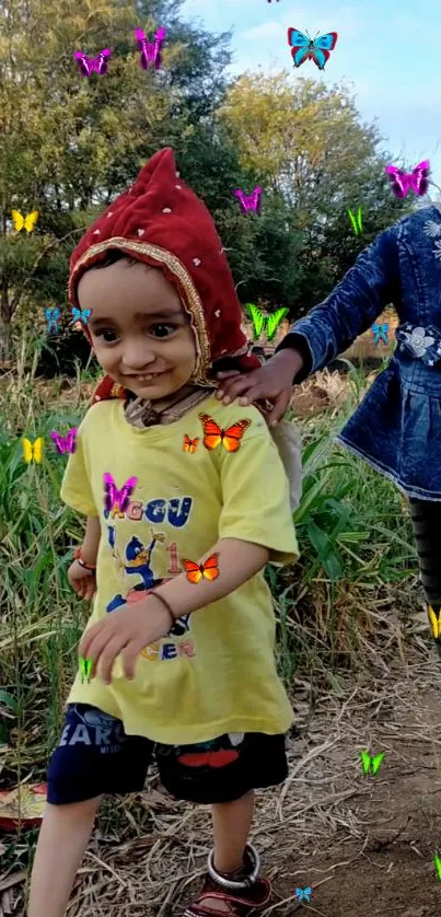 Children playing outdoors with butterflies.