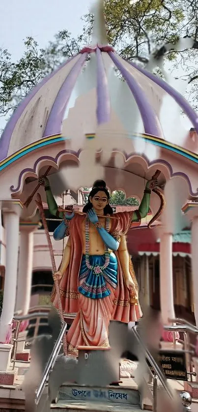 Colorful Krishna statue in temple setting with intricate details.