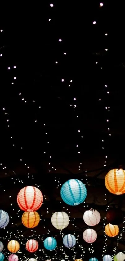 Colorful lanterns against a starry black sky, ideal for mobile wallpaper.