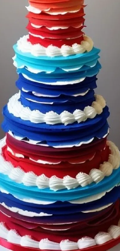 Vibrant multi-layered cake with red, blue, and white frosting.