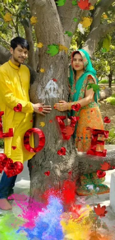 Couple under tree with colorful love decoration.