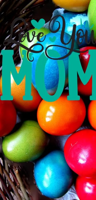 Colorful Easter eggs with 'Love You Mom' text in basket.