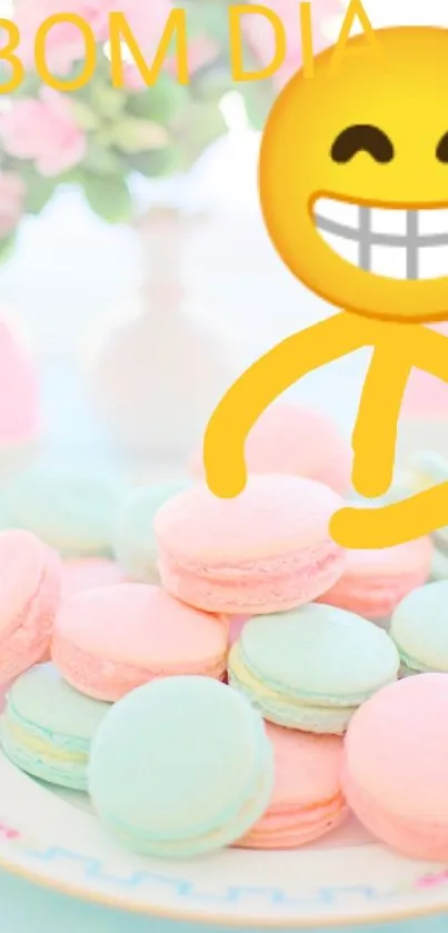 Cheerful morning wallpaper with colorful macarons, a smiling emoji, and pink flowers.