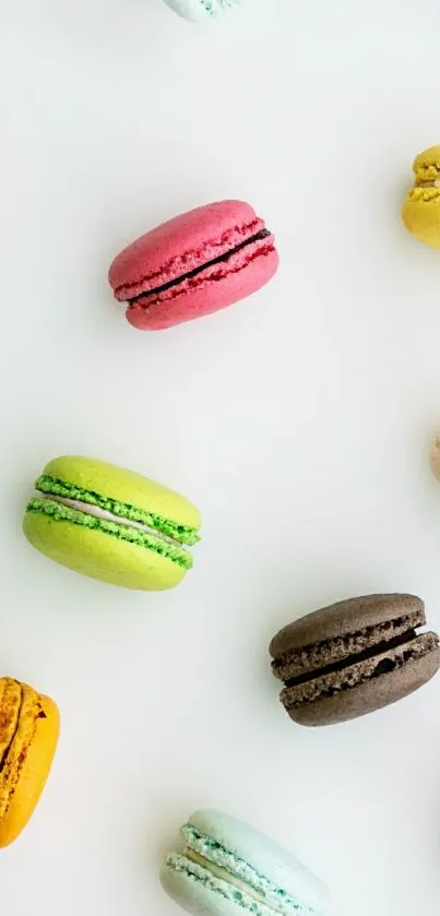 Colorful macarons on white background, vibrant mobile wallpaper.