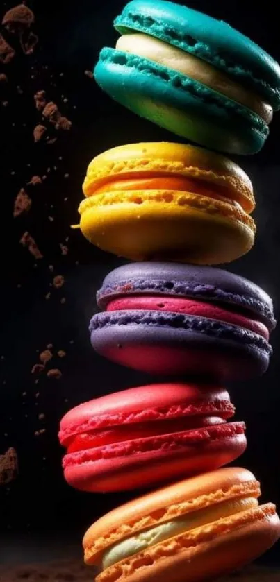 A vibrant stack of colorful macarons against a black background.