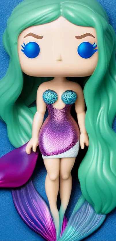 Whimsical mermaid figurine with green hair on a blue background.