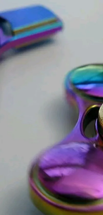 Colorful metallic fidget spinner close-up wallpaper.