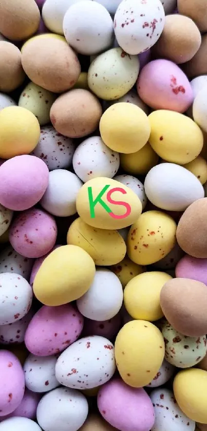Multicolored pastel mini eggs with a KS initials logo in center.