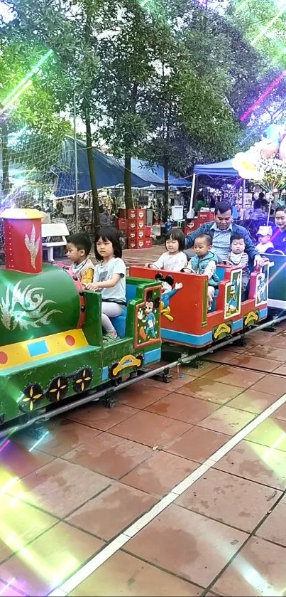 Children enjoying a colorful mini train ride in a vibrant park.