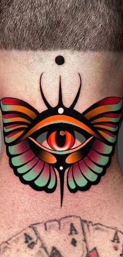 Colorful eye tattoo with wings on neck.