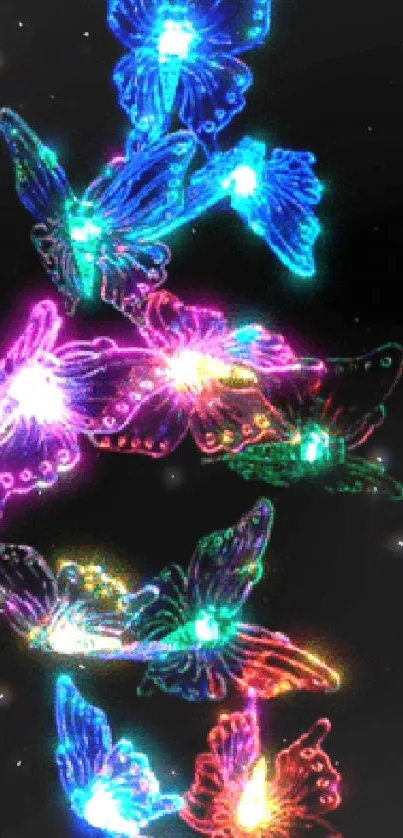 Vibrant neon butterfly wallpaper glowing in colorful designs on a black background.