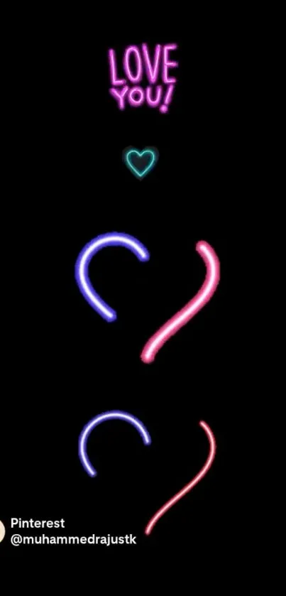 Neon heart design with text on black background.