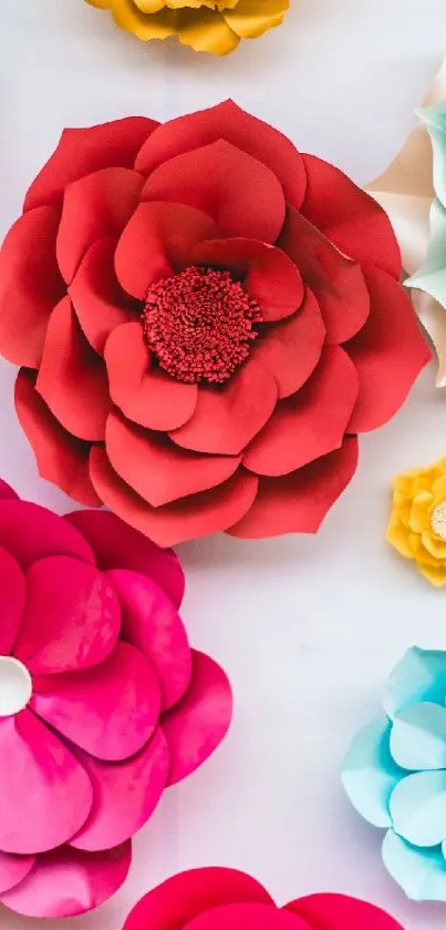 Vibrant paper flowers in red, pink, and blue hues.