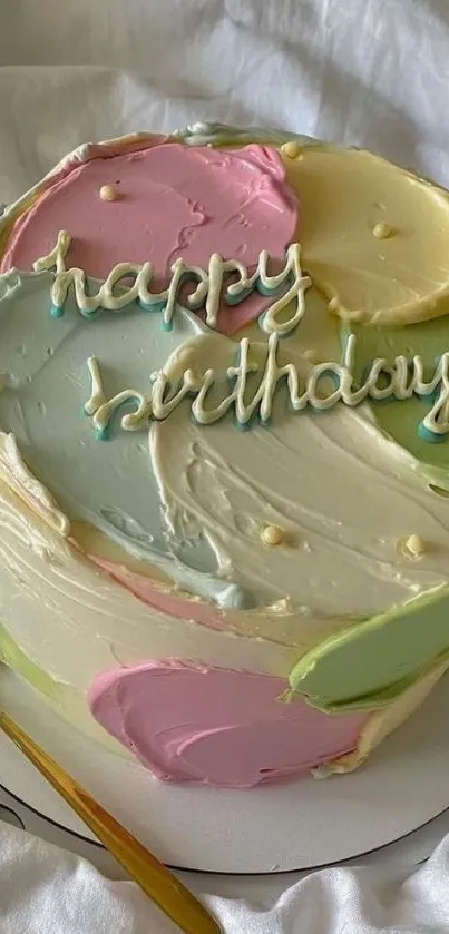 Vibrant pastel birthday cake with colorful icing swirls and 'happy birthday' text.