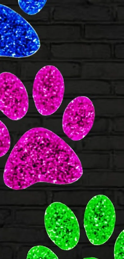 Colorful glitter paw prints on black brick wallpaper.