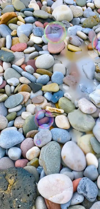 Mobile wallpaper with colorful pebbles and floating bubbles.