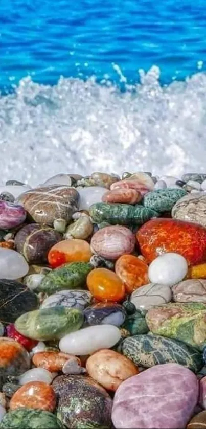 Vibrant beach with colorful pebbles and blue ocean backdrop.