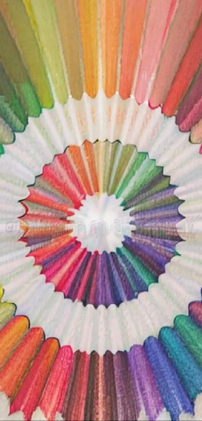 Vibrant colored pencils arranged in a circle pattern forming a rainbow design.