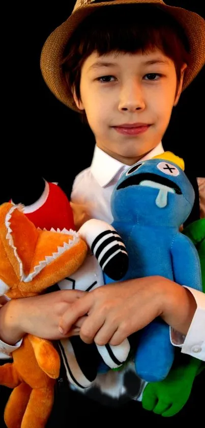 Young boy with vibrant plush toys against a dark background.