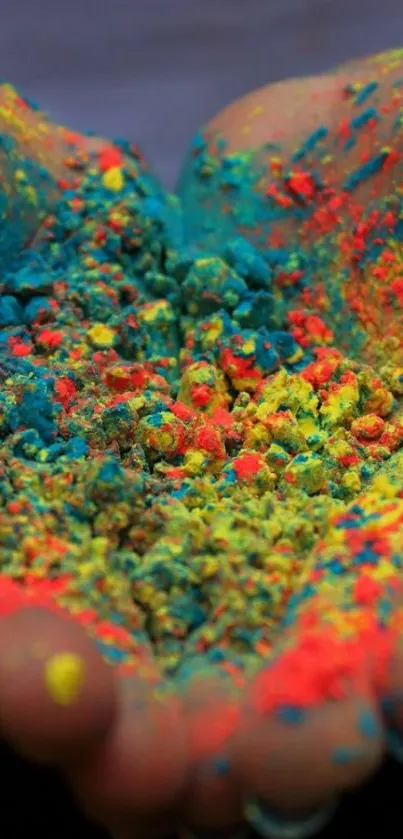 Vibrant colorful powder in hands, full of vivid hues.