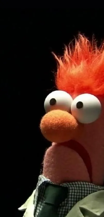 Colorful puppet with orange hair on black background wallpaper.