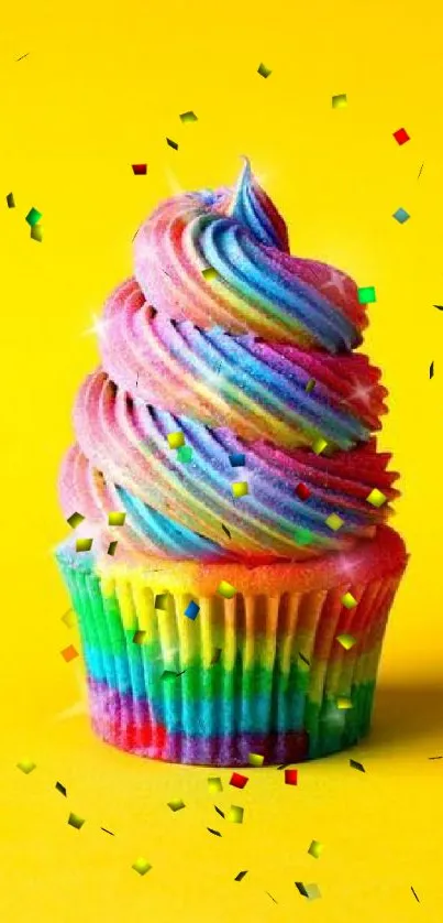 Colorful rainbow cupcake with a bright yellow background.