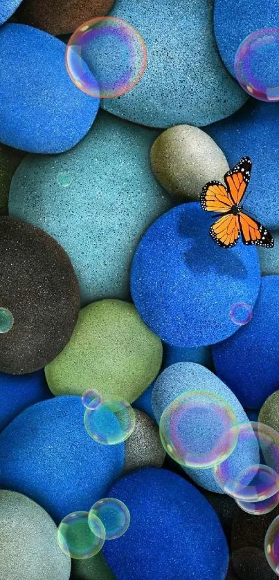 Colorful stones with an orange butterfly.