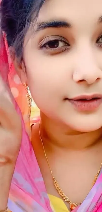 Vibrant portrait of a woman in a colorful sari.