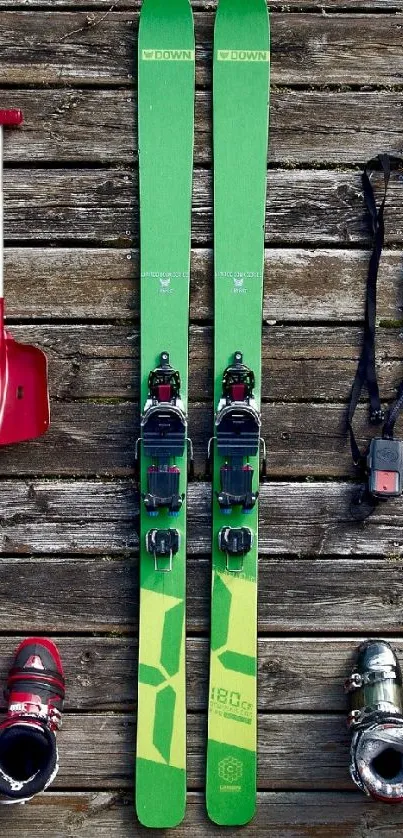 Colorful ski equipment arranged on wood planks.