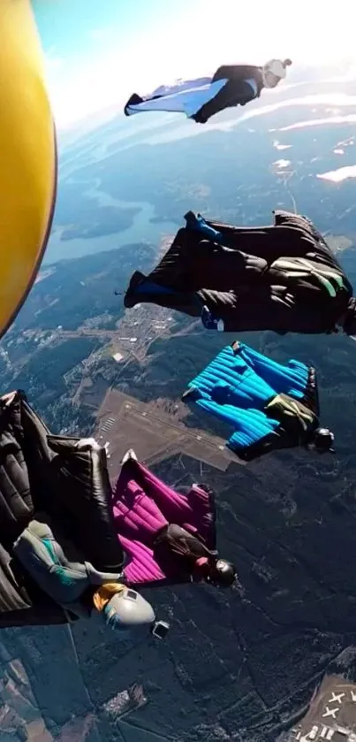 Skydivers in colorful suits soaring against a beautiful aerial landscape.