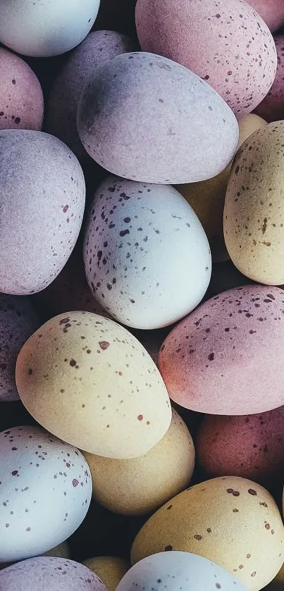 Colorful speckled eggs in pastel tones.