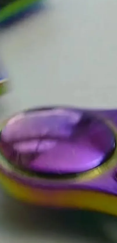 Close-up of a colorful purple and yellow spinner.