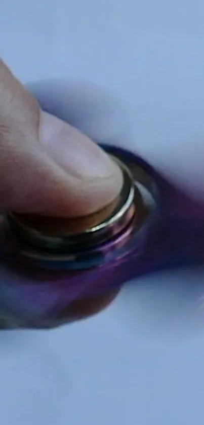 Close-up of colorful spinning fidget toy creating a swirling motion effect.