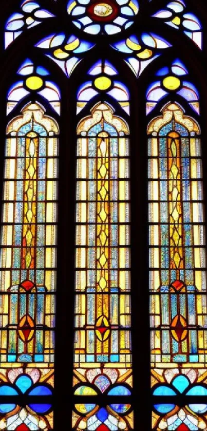 Intricately designed stained glass window with rich, vibrant colors and medieval patterns.