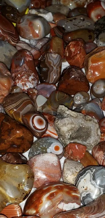 Vibrant collection of colorful, polished stones resting on a white surface.