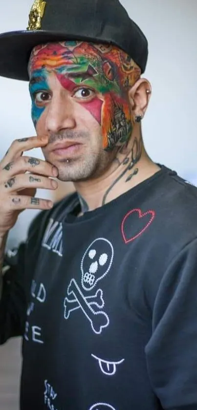 Portrait with colorful face tattoo and stylish black attire.