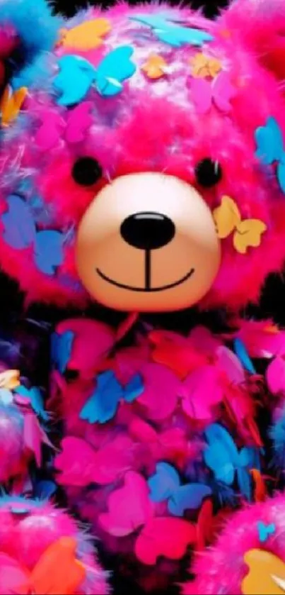 Colorful teddy bear with butterfly decorations on black background.