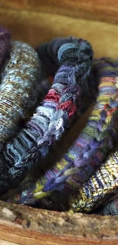 Intricate woven fabric pattern with vibrant colors in a wooden bowl.