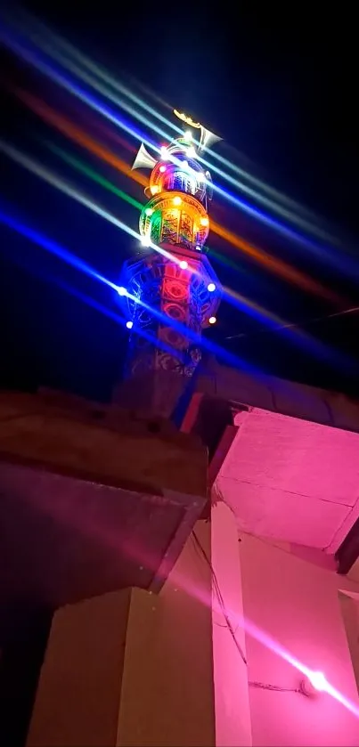 Colorful tower lights shining against a night sky background.