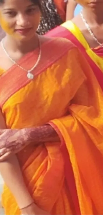 Traditional orange saree and jewelry in vibrant colors.