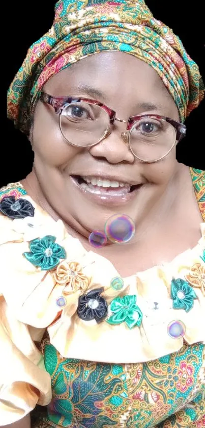 A smiling person in colorful African attire as a phone wallpaper.