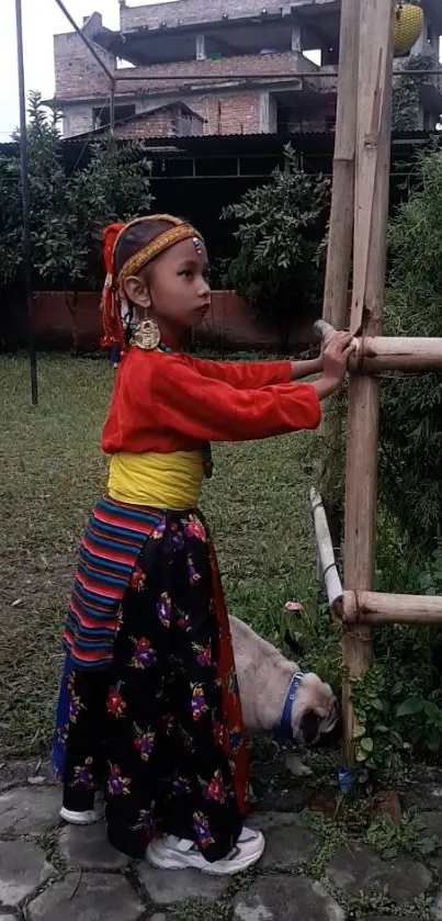 Child in traditional attire with vivid colors, set in a garden scene.