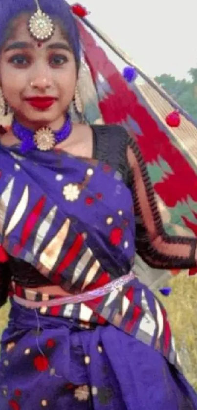 Person in vibrant traditional attire with colorful design and ornaments.