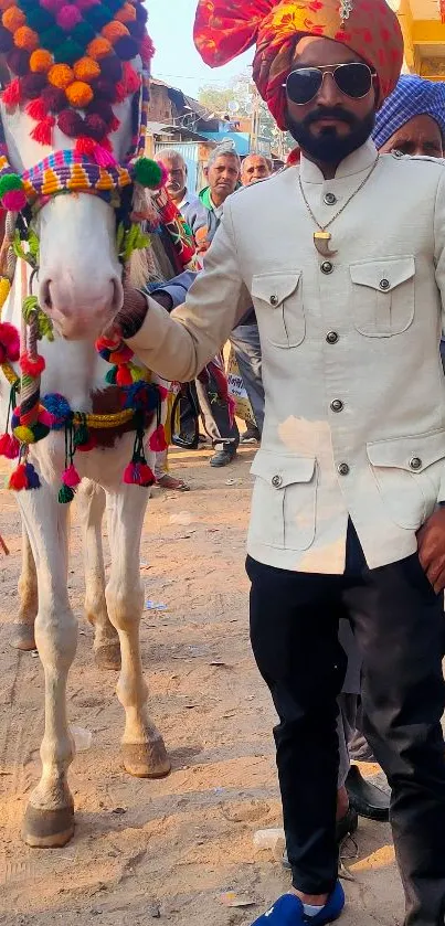 Man in traditional attire with a decorated horse.