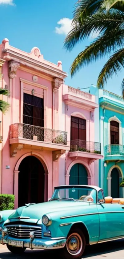 Vintage turquoise car on vibrant tropical street with pastel buildings.