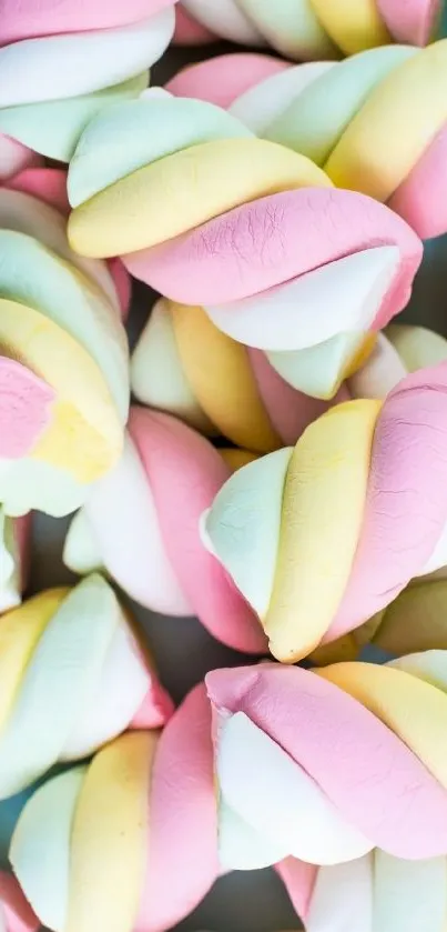 Twisted pastel marshmallows with pink, yellow, and white hues.