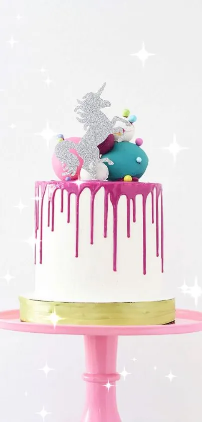 Whimsical unicorn cake on pink stand with colorful decorations.