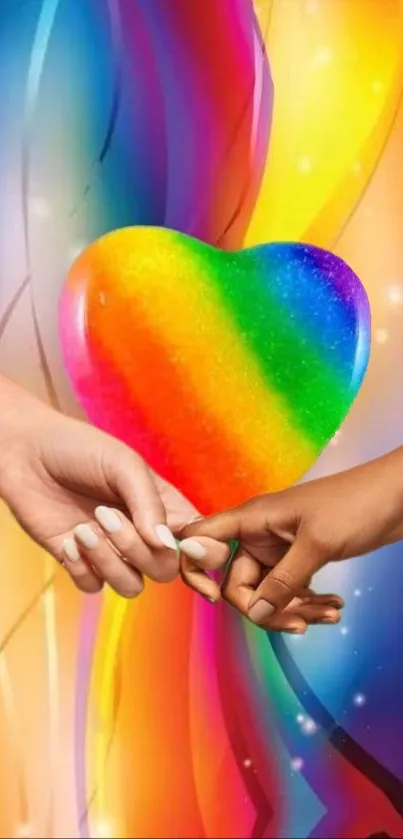 Colorful wallpaper with rainbow heart held by two hands.